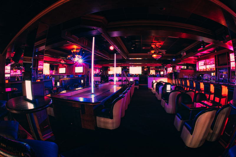 The main room and bar at Rachel's North in Casselberry, Florida, with table seating and stage