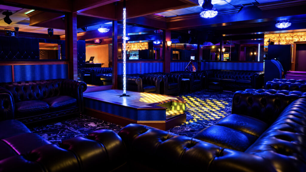 The private dance stage upstairs under colored lights at Rachel's North in Casselberry, Florida