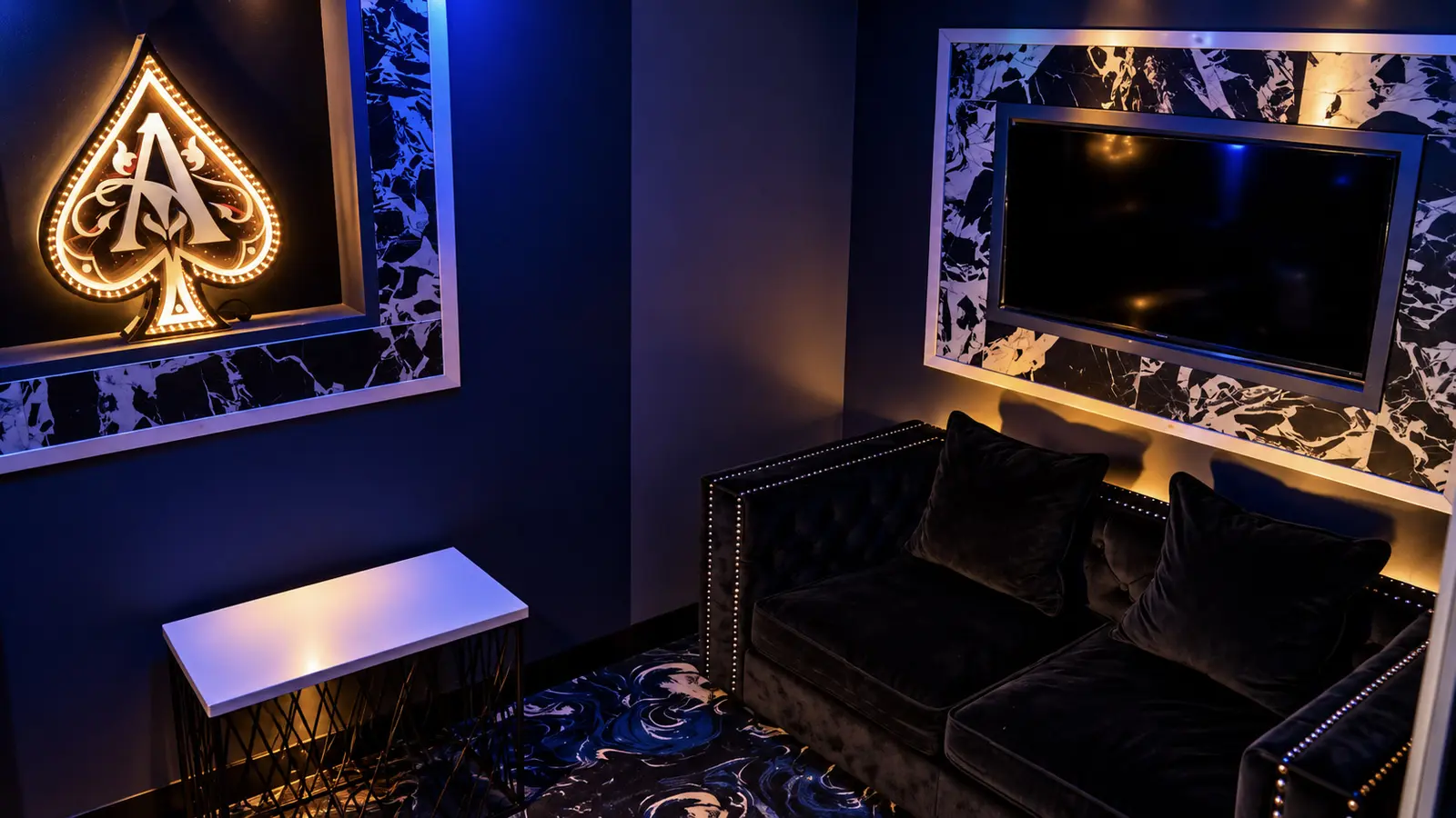 The PJ Room, a private room at Rachel's North in Casselberry, with a velvet sofa, illuminated ace of spades and private screen